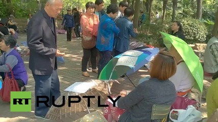 China: Parents advertise their single children for marriage at 'Blind Date Corner'