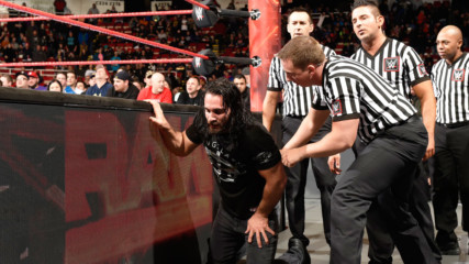 Seth Rollins is helped out of the Raw arena following his encounter with Triple H: WWE.com Exclusive, March 13, 2017