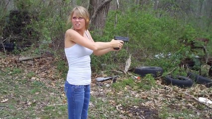 Girl shooting Springfield Xd40 sub-compact