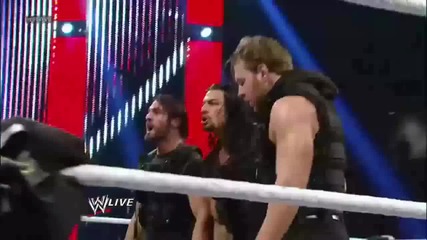 The Shield hits a Triple Powerbomb on The Rock