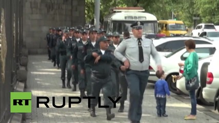 Armenia: Protesters and police scuffle outside parliament