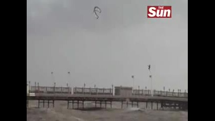 Kite Surfer Jumps Over Pier 