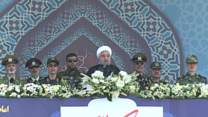 Iran: Rouhani vows to defend Iran amid huge military parade