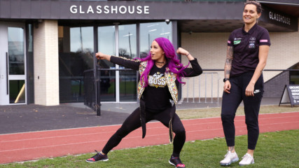 Sasha Banks kicks back with AFLW's Moana Hope