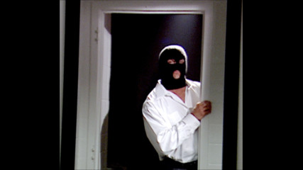 A masked man is stalking Ric Flair: Raw, May 26, 2003