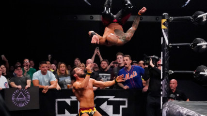 Ricochet takes flight and flattens Johnny Gargano on the outside: NXT TakeOver: Phoenix (WWE Network Exclusive)