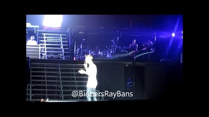 Justin holding up a bra thrown on stage. My video 8_3_13