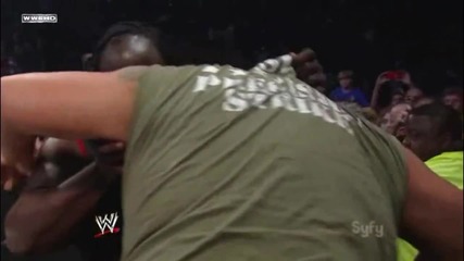 Big Show Chokeslams Mark Henry through the Announcer Table