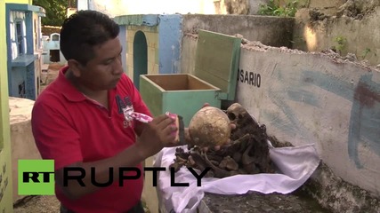 Mexico: Families clean late relatives' bones ahead of Day of the Dead celebrations