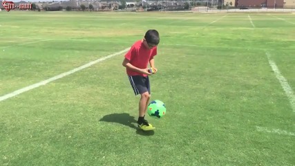 11 year old solves a rubik's cube while juggling a soccer ball