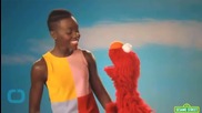 Elmo Sings 'Shake It Off' During Vaccination