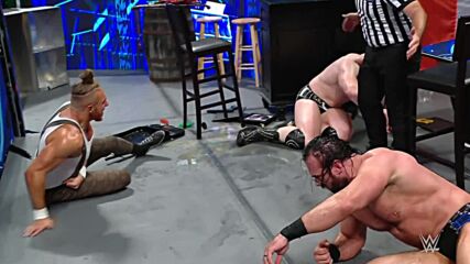 Butch takes flight off a pile of barrels to help Sheamus against Drew McIntyre