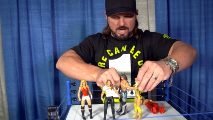 AJ Styles checks out Ronda Rousey's first WWE action figure