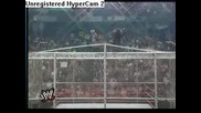 Undertaker throws Rikishi off the top of the cell