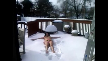 Mom in bikini for Make A Wish Foundation making snow angels