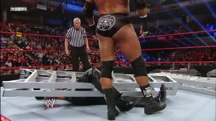 Triple H uses a ladder to help him apply the Figure Four on Kevin Nash: Wwe Tlc 2011