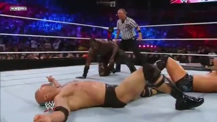 R-truth breaks a Sharpshooter with a Little Jimmy