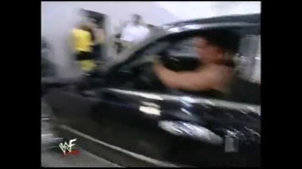 Mark Henry trys to hold back a limo with his legs for 30 seconds
