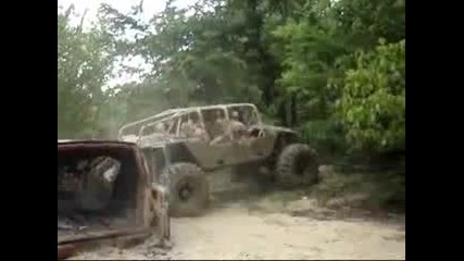 buggy climbs over van 