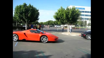 Orange Ferrari Enzo and Black Orange Bugatti Veyron Leave