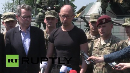 Ukraine: Yatsenyuk rides atop BTR-70, inspects drones as US troops train in Lviv