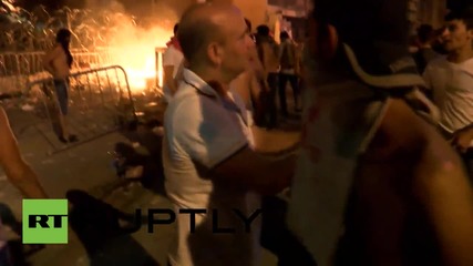 Lebanon: Protesters build fire outside Beirut's Government Palace
