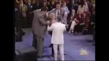 Benny Hinn goes down off the platform and anoints crowd 