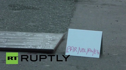 France: Forensic experts inspect suicide bomber's body outside cafe 'Comptoir Voltaire'