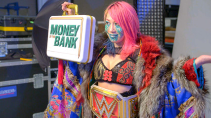 Asuka poses with the Raw Women’s Championship: WWE.com Exclusive, May 11, 2020