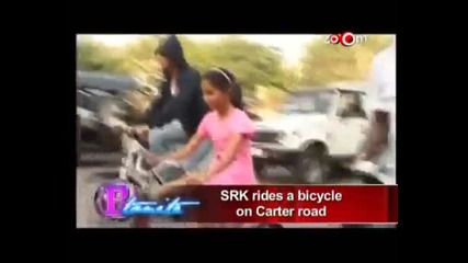 Shahrukh Khan rides a bicycle