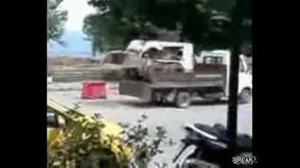 Bobcat Loads Itself Onto Truck