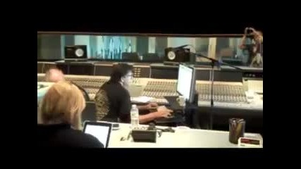 Kelly Clarkson in studio recording mistery duet 