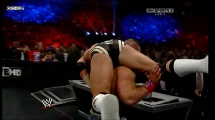 Attitude Adjustment through the announcer table - John Cena