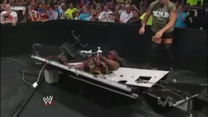 Big Show Chokeslams Mark Henry through the Announcer Table