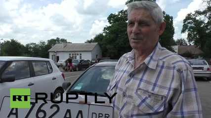 Ukraine: Donetsk locals swap Ukrainian license plates for DPR registration