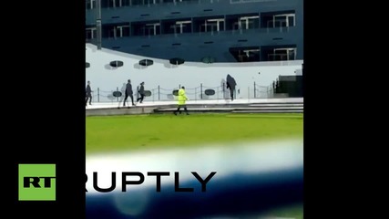 UK: Security guards chase 'Death' around DSEI Arms Fair grounds