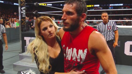 Candice LeRae helps a battered Johnny Gargano from the ring: WWE.com Exclusive, June 16, 2018