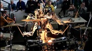 4 Armed Mohawked Robot playing the drums