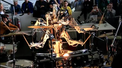 4 Armed Mohawked Robot playing the drums