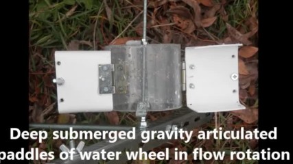 Hydrokinetic power barge with deep submerged water wheels with articulated paddles in slow flow