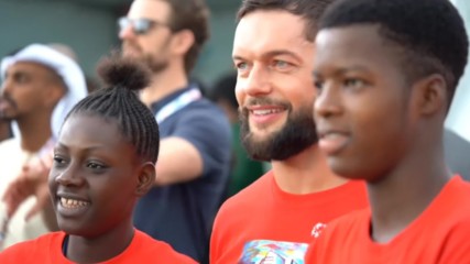 Finn Bálor gives a memorable gift to an athlete at the Special Olympics World Summer Games