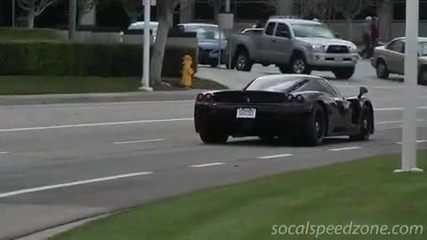 Black Ferrari Enzo leaving Cars and Coffee 