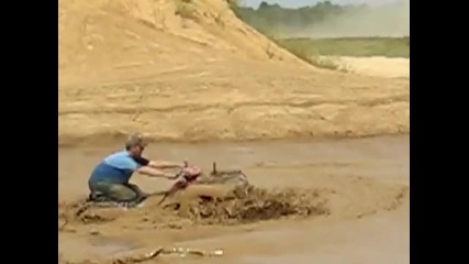 kawasaki 650 wheelie in the mud