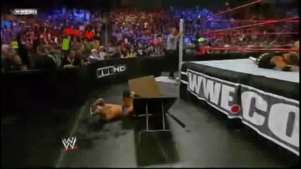 The Miz throws Alex Riley on Randy Orton through a Table