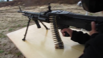Hot chick shooting M-60 machine gun!