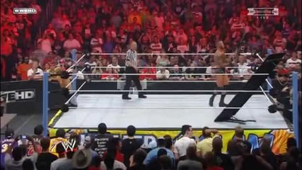 Randy Orton throws Christian off the apron through a table