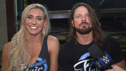 Charlotte Flair & AJ Styles engage in a post-match Woo-off