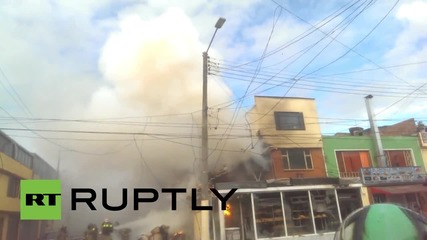 Colombia: Firefighters extinguish blaze after plane crashes into Bogota bakery