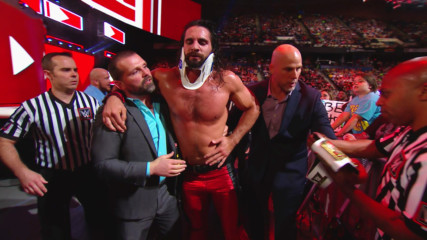 Seth Rollins is helped out the arena following Elias' attack: Raw, May 28, 2018