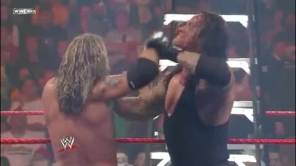 Undertaker Chokeslams Edge from the Apron through a Ladder
